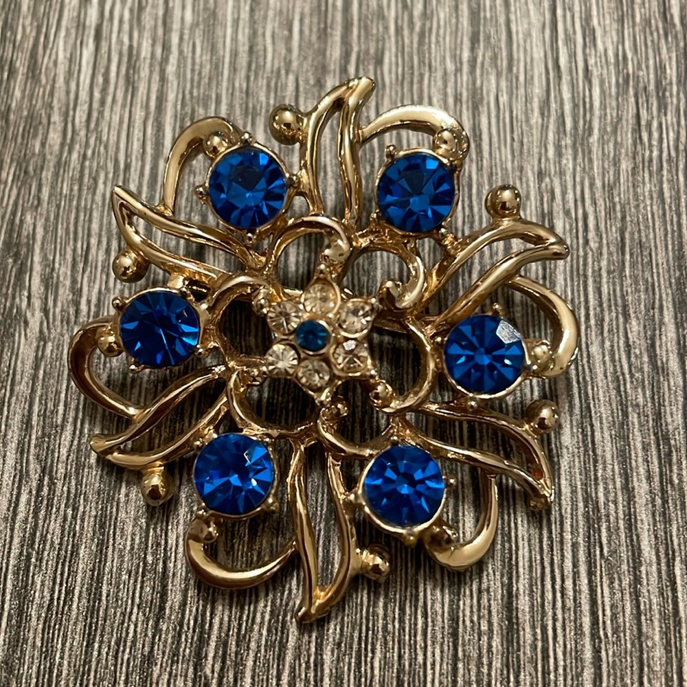 Blue and gold brooch